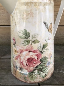Large jug with beautiful images, made of metal