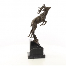A bronze sculpture of a jumping deer