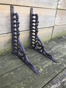 Set of antique sleek shelf supports, cast iron.