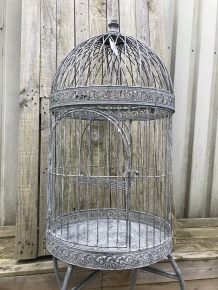 A very pretty decorative birdcage made of iron